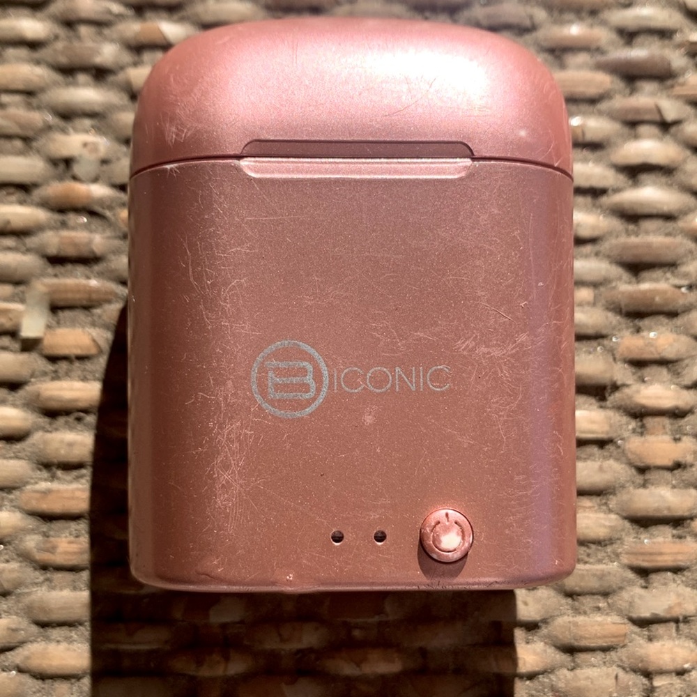 Iconic earbuds in chargeable case never used